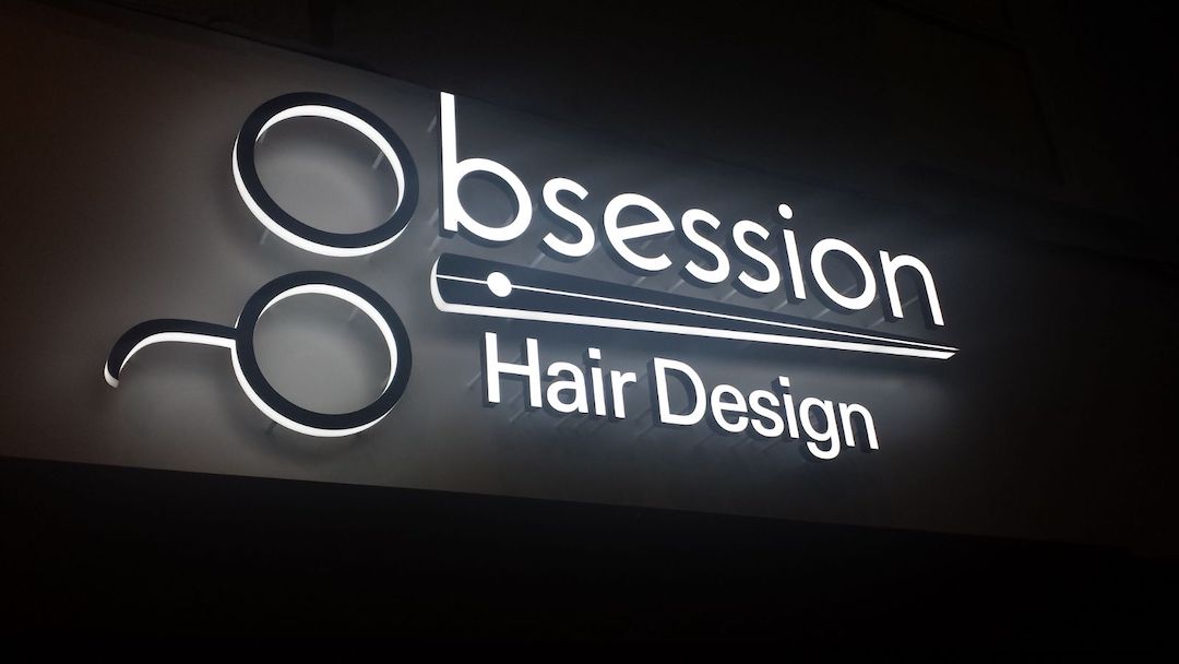 banner image of Obsession Hair Design shop sign